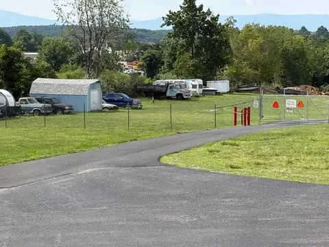 Outdoor RV, boat and vehicle storage lot behind a security fence at American Mini Storage in Staunton, VA