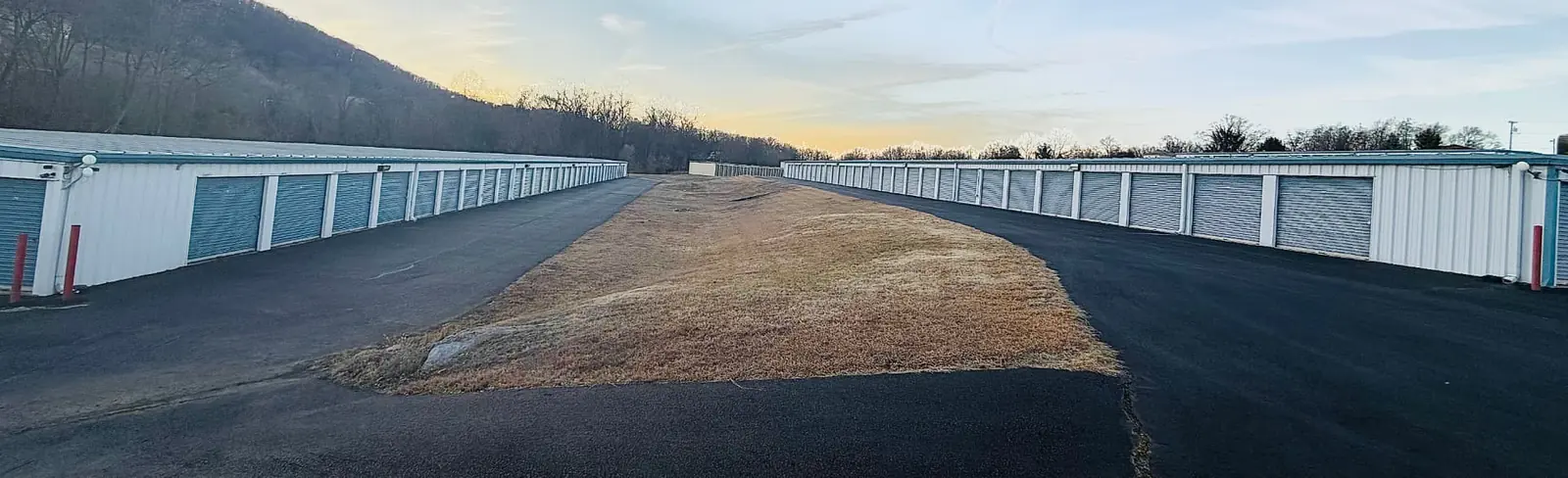 Long rows of drive-up storage units with mountain views at American Mini Storage in Staunton, Virginia